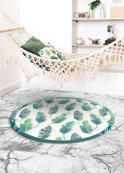 Tapis vinyle rond feuilles tropicales
